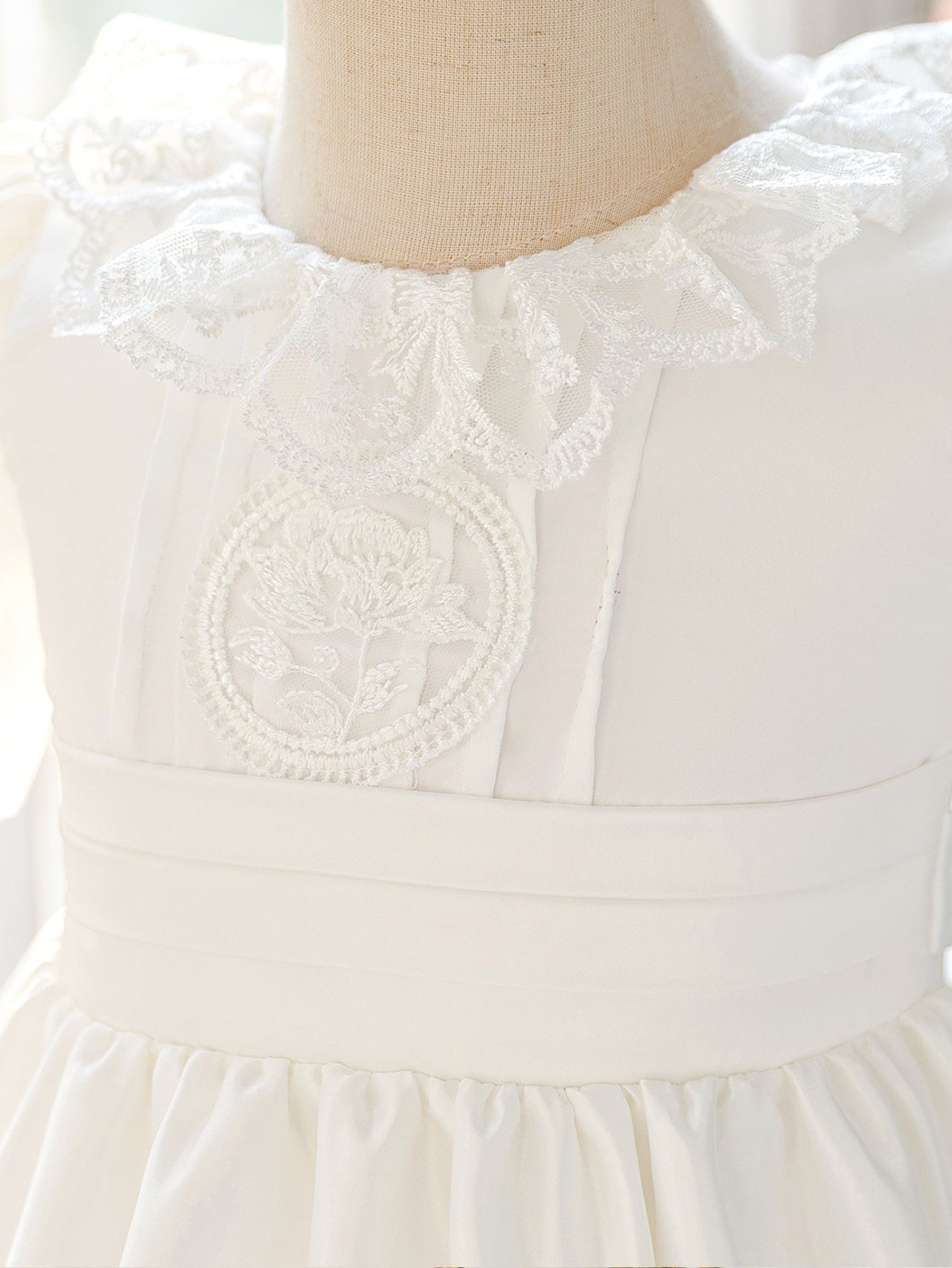 girls' dress with lace trim and embroidery